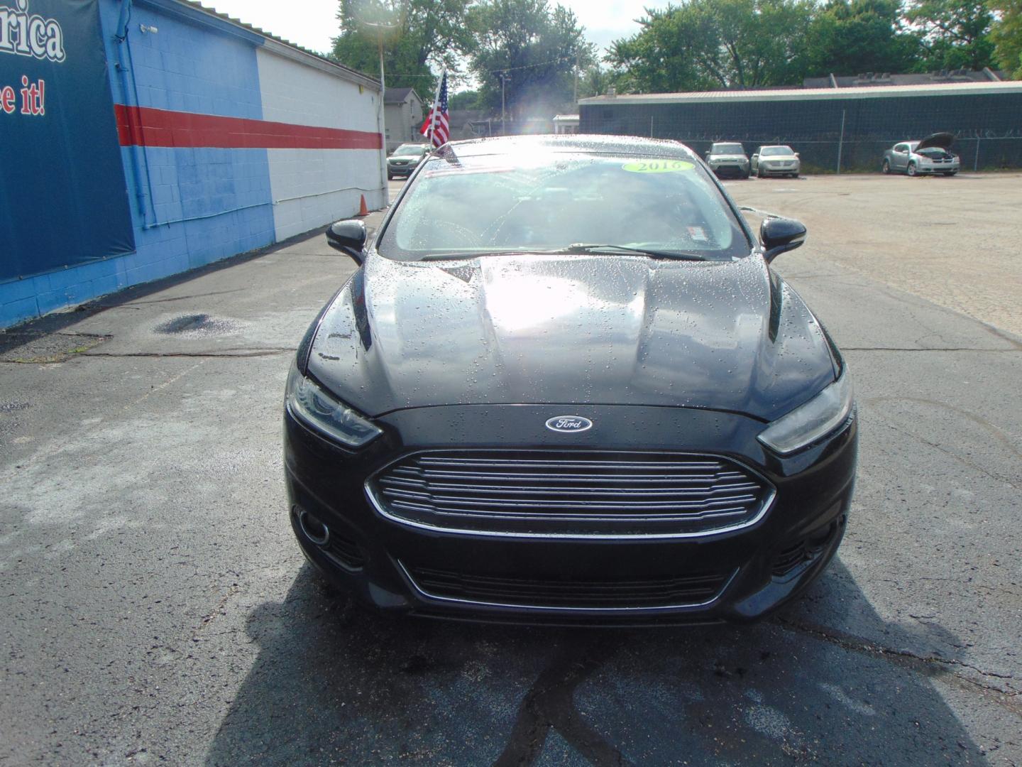 2016 Black Ford Fusion (3FA6P0K97GR) with an 4-Cyl EcoBoost 2.0T engine, Auto, 6-Spd SelectShift transmission, located at 2105 Dixie Hwy, Louisville, KY, 40210, (502) 772-3333, 38.220932, -85.795441 - Photo#2